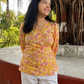 Yellow floral wrap top